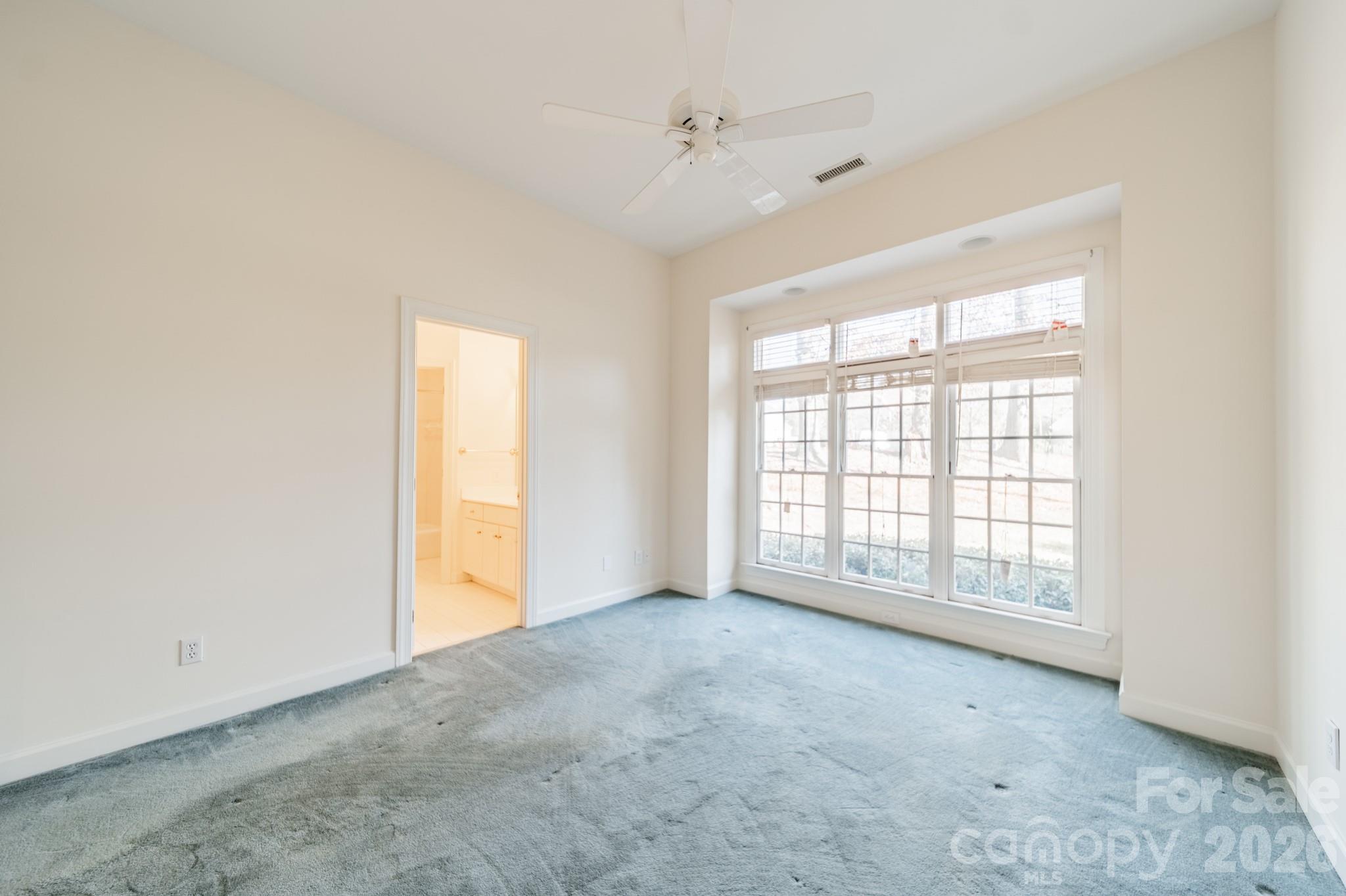 316 Kimberly Road Davidson, NC 28036 - Photo 20 of 37 a view of an empty room with a window