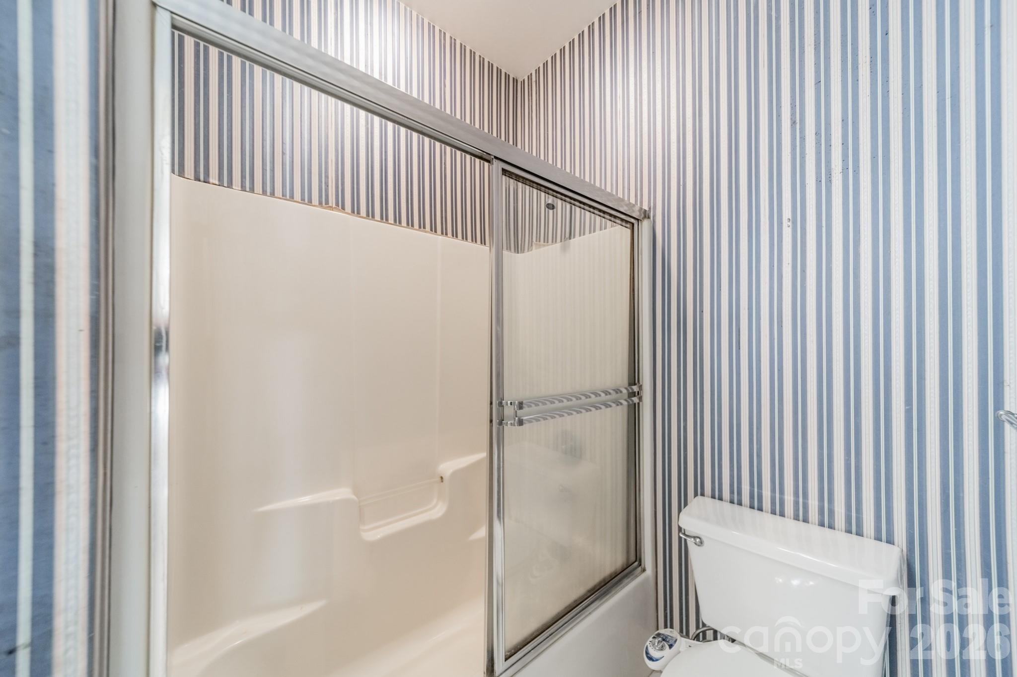 316 Kimberly Road Davidson, NC 28036 - Photo 28 of 37 a view of a bathroom with a glass door shower