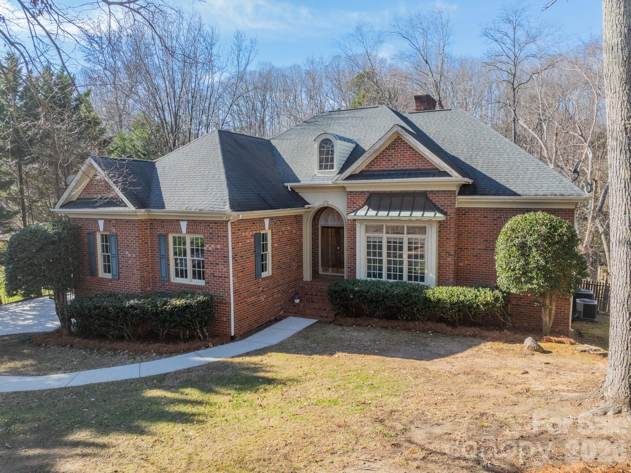 316 Kimberly Road Davidson, NC 28036 - Photo 37 of 37 a front view of a house with garden
