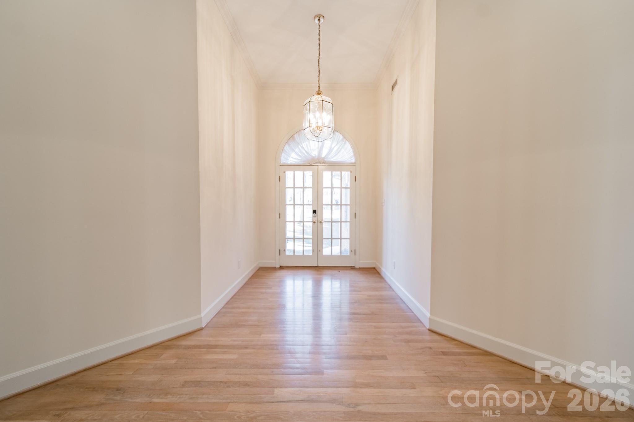 316 Kimberly Road Davidson, NC 28036 - Photo 6 of 37 a view of a room with wooden floor fan and windows