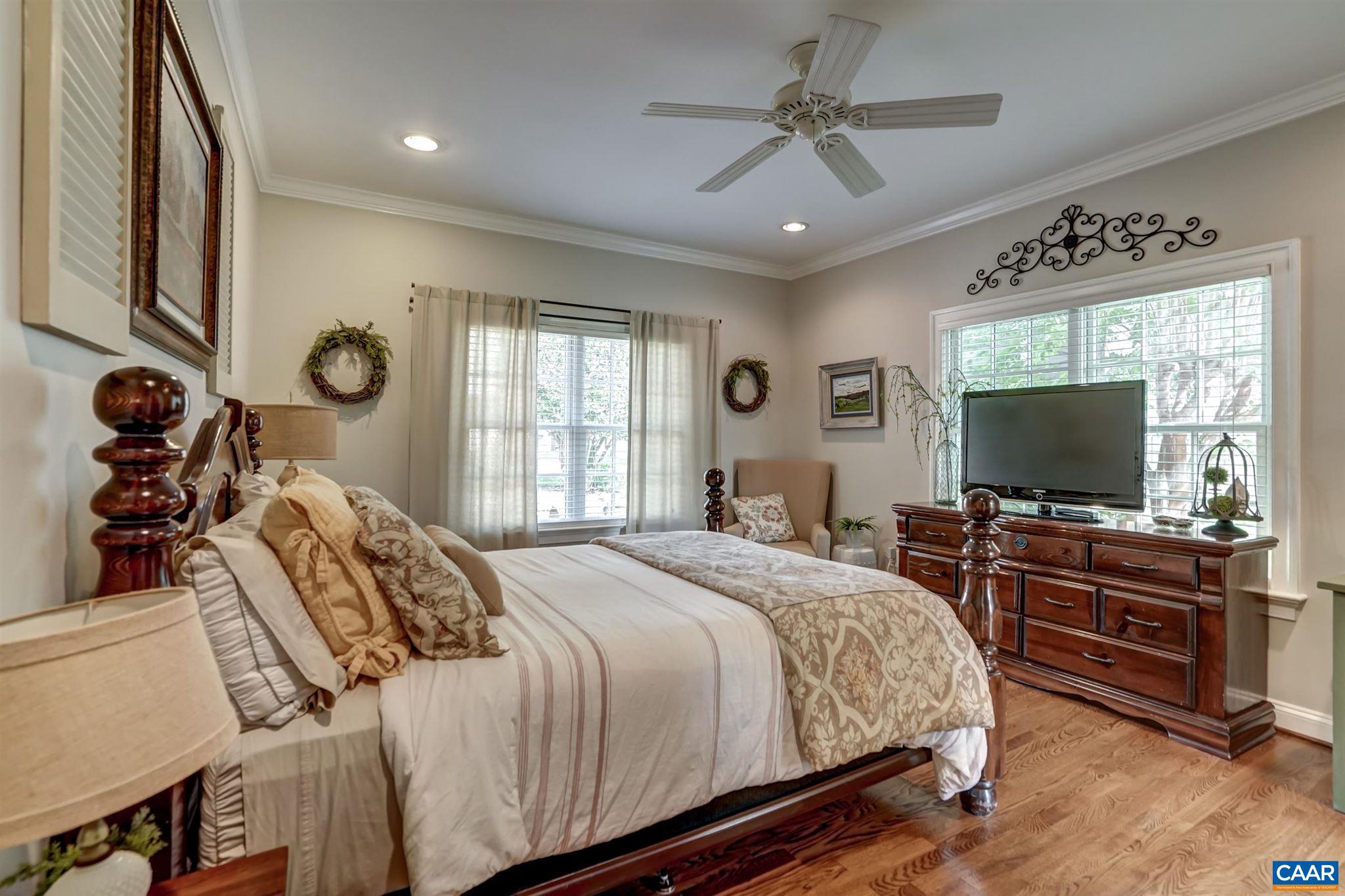 5047 Brook View Road Crozet, VA 22932 - Photo 21 of 68 a bedroom with a bed and a flat screen tv