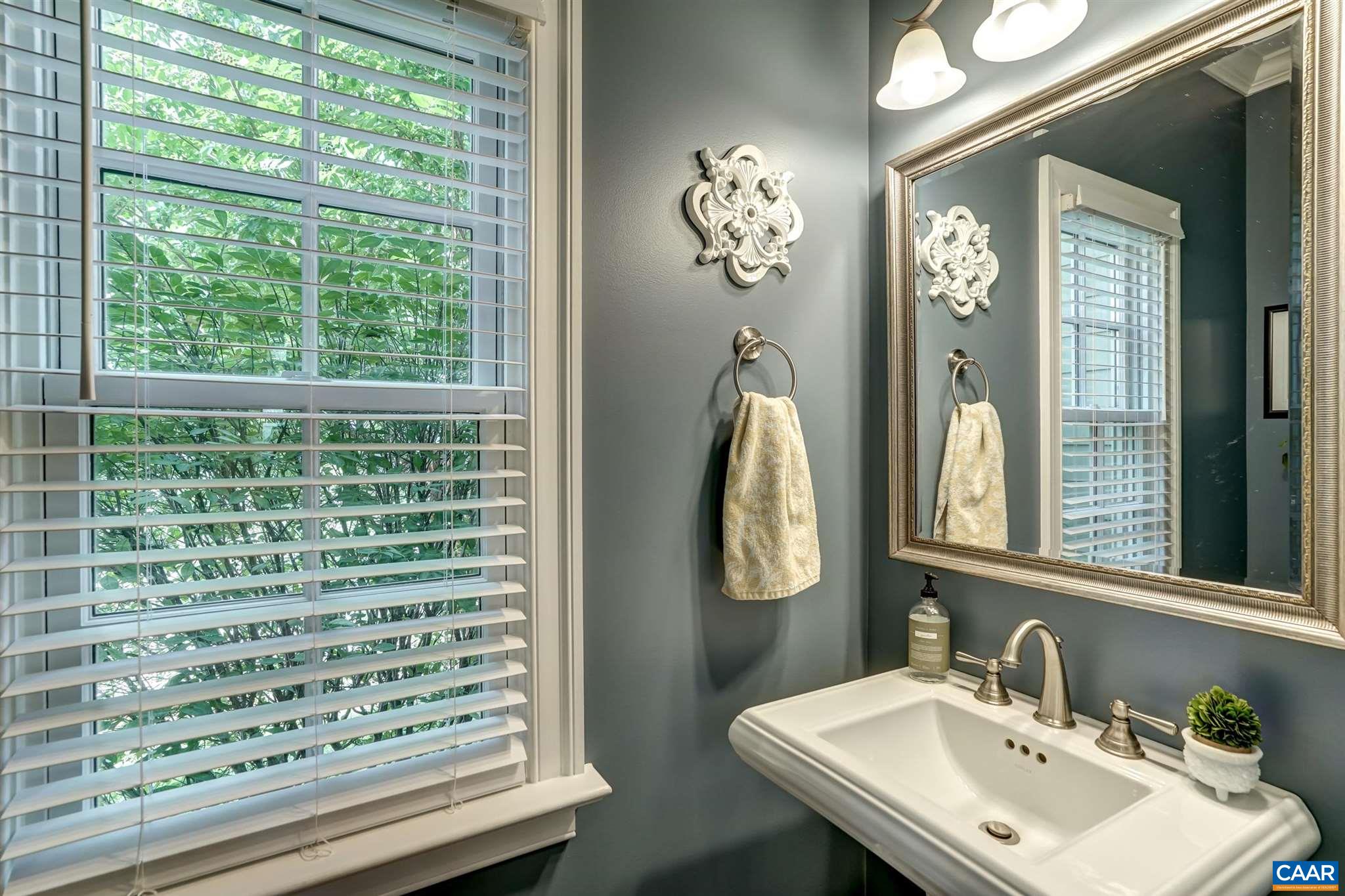 5047 Brook View Road Crozet, VA 22932 - Photo 26 of 68 a bathroom with a sink a mirror and a window