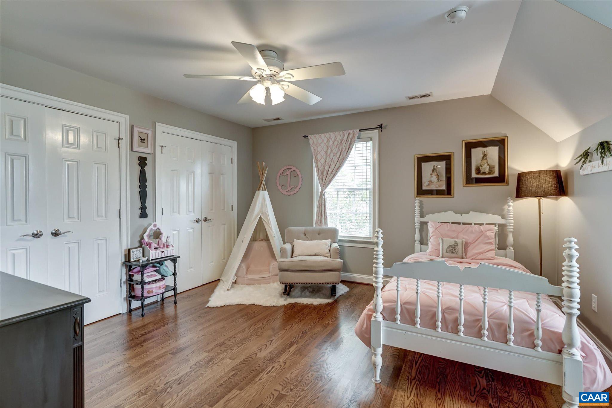 5047 Brook View Road Crozet, VA 22932 - Photo 31 of 68 a bedroom with a bed and wooden floor