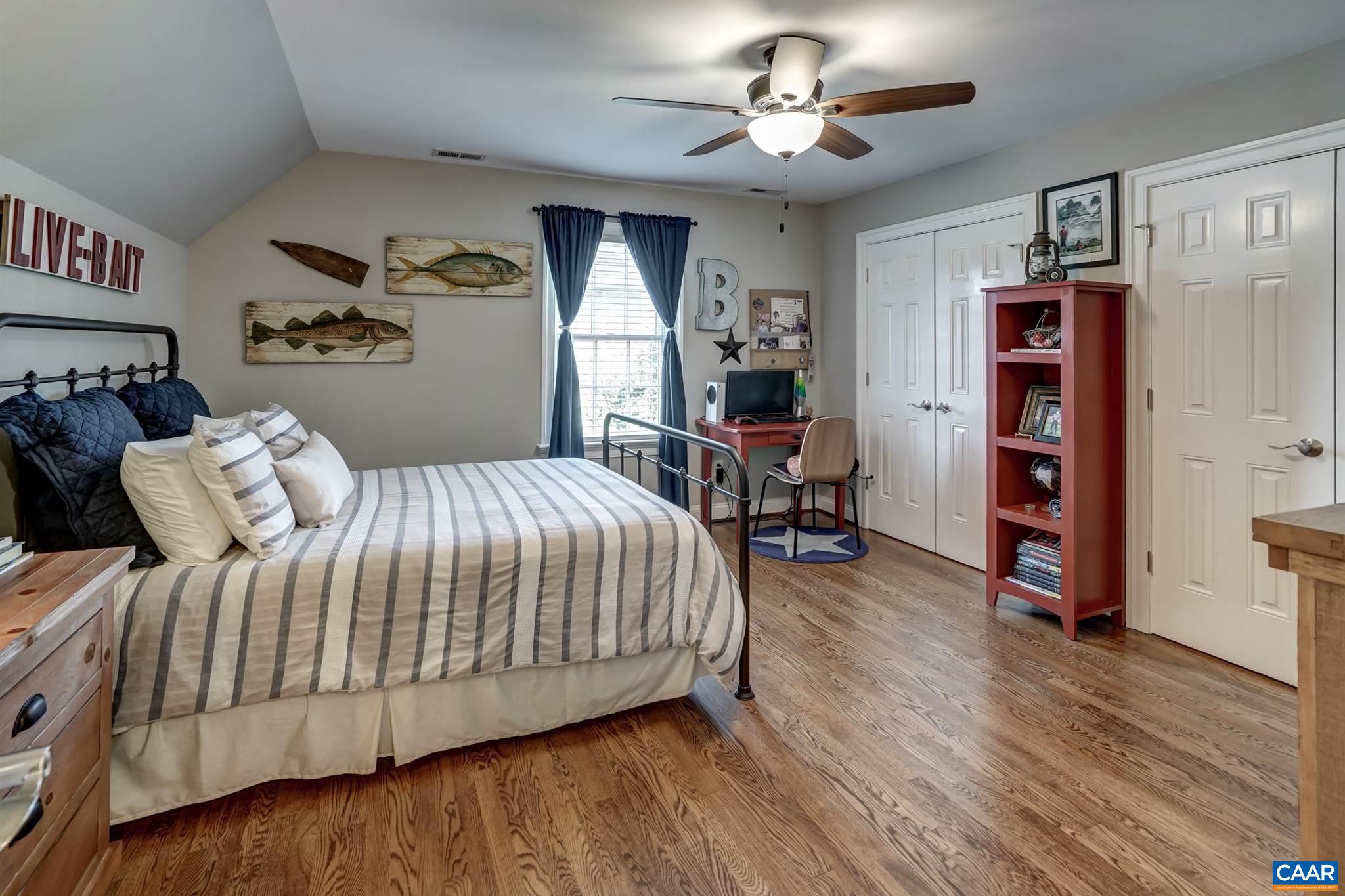 5047 Brook View Road Crozet, VA 22932 - Photo 33 of 68 a bedroom with a bed and a chandelier