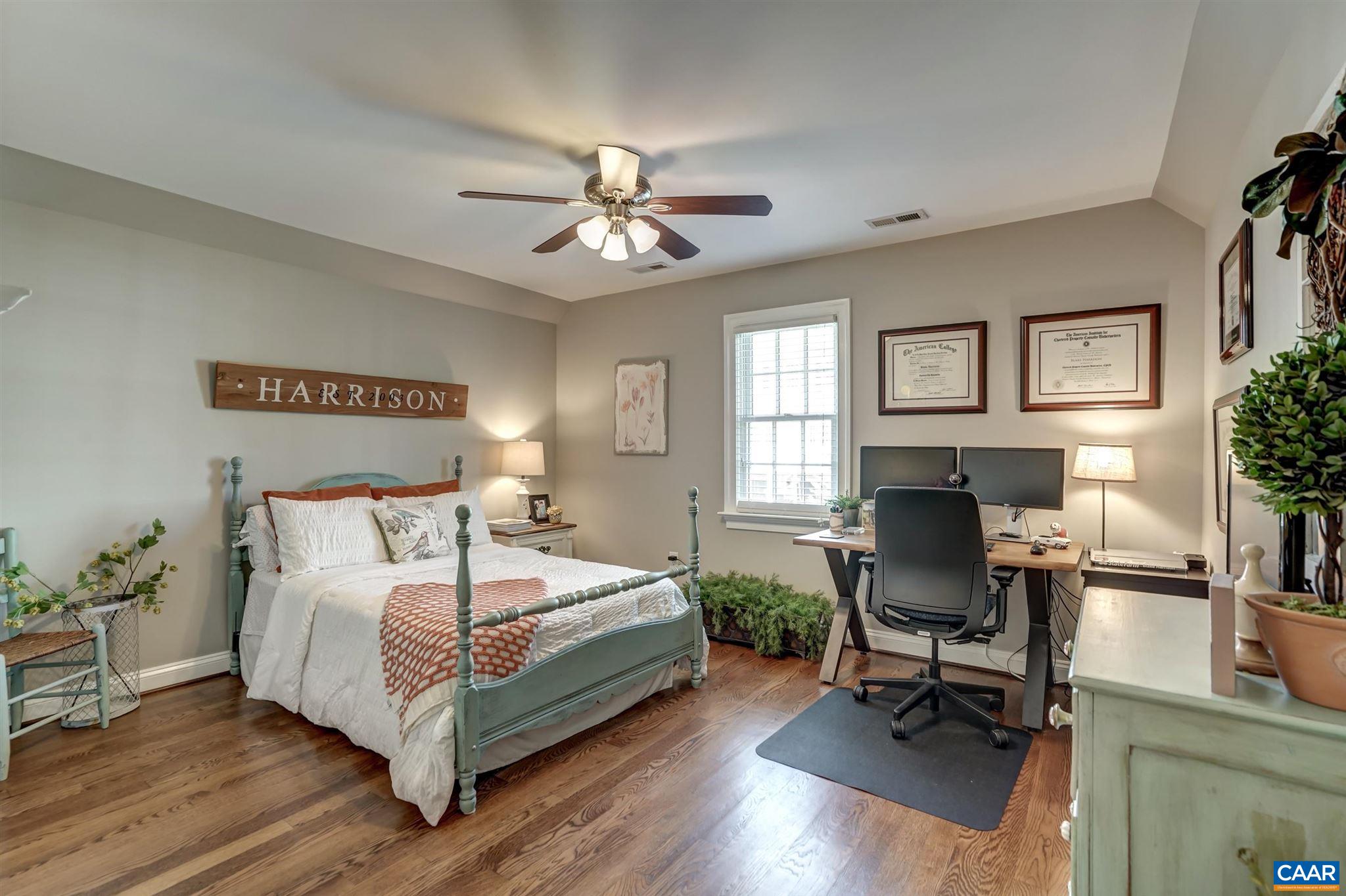 5047 Brook View Road Crozet, VA 22932 - Photo 38 of 68 a bedroom with a bed and a chair