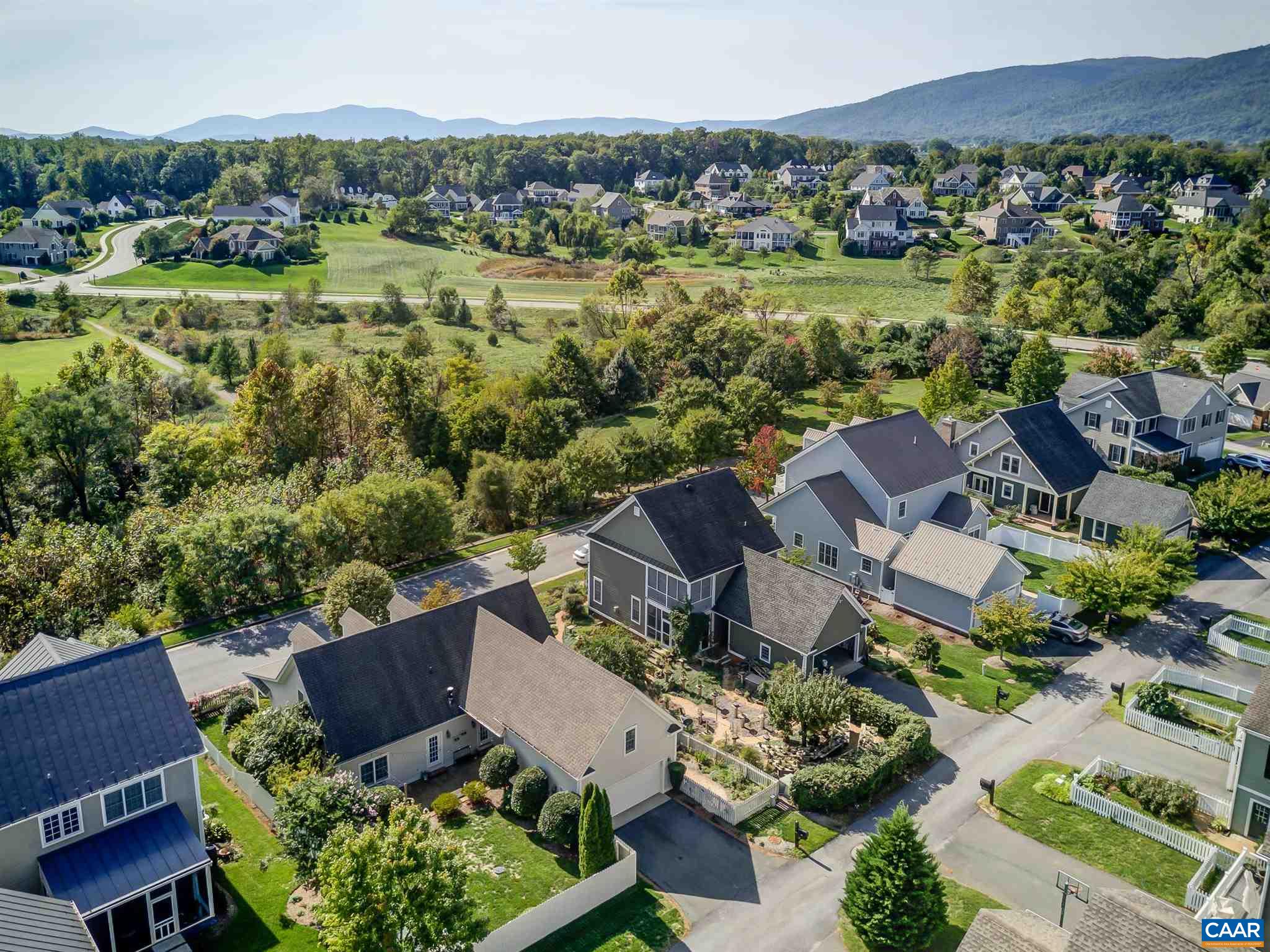 5047 Brook View Road Crozet, VA 22932 - Photo 55 of 68 an aerial view of a house with a garden and lake view