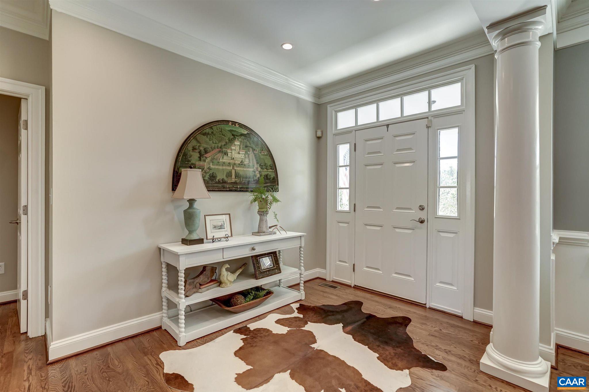 5047 Brook View Road Crozet, VA 22932 - Photo 6 of 68 a room with a wooden floor and a potted plant