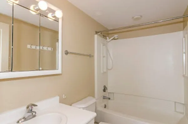 a bathroom with a bathtub and a shower