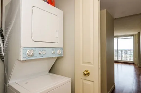 a close view of a utility room with dryer and washer