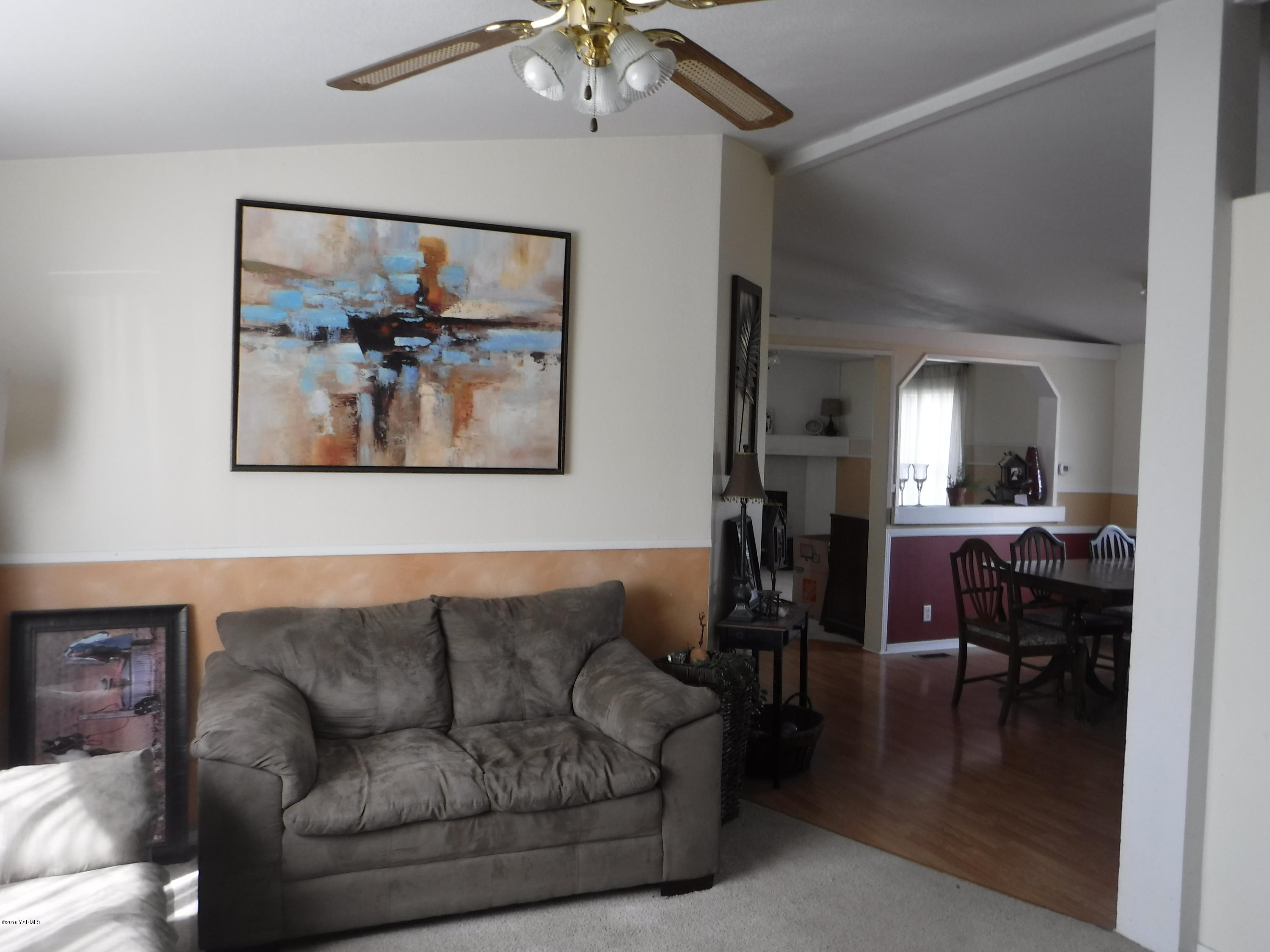 495 Burnham Road Yakima, WA 98908 - Photo 25 of 36 a living room with furniture and a chandelier