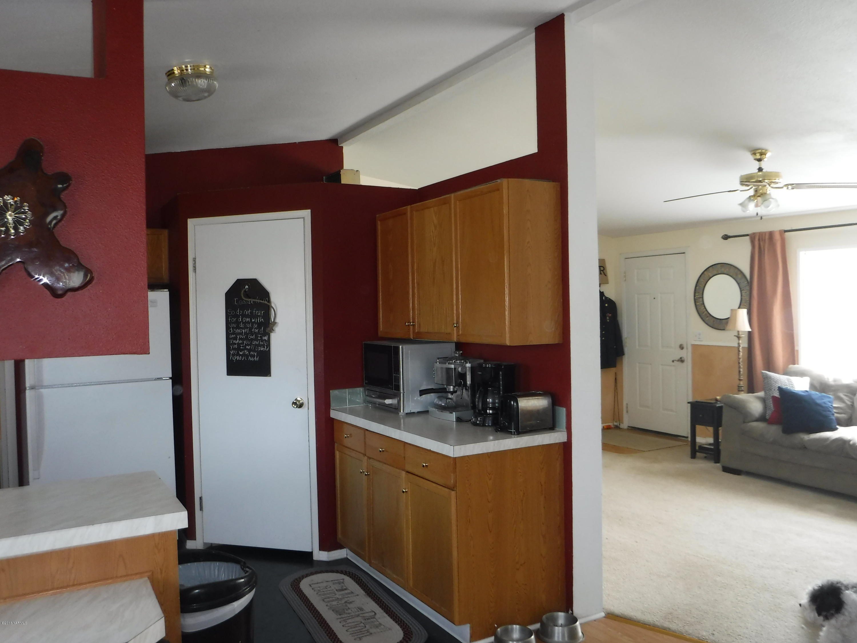 495 Burnham Road Yakima, WA 98908 - Photo 28 of 36 a kitchen with a refrigerator and a sink