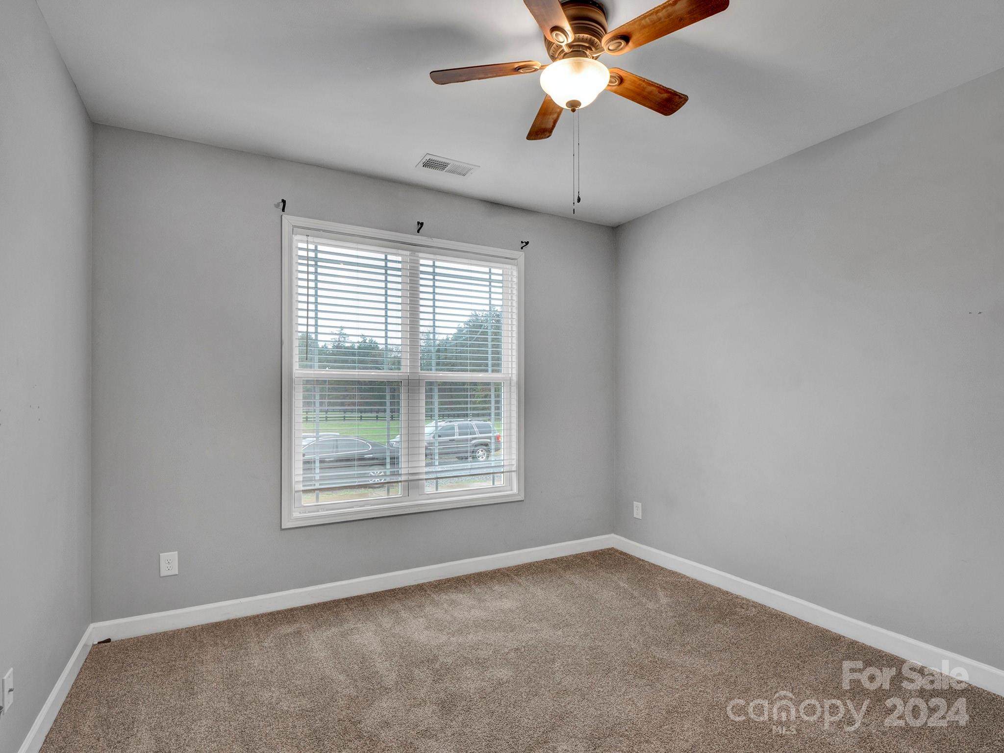 1854 State Rd S-46-168 York, SC 29745 - Photo 36 of 46 an empty room with windows and fan