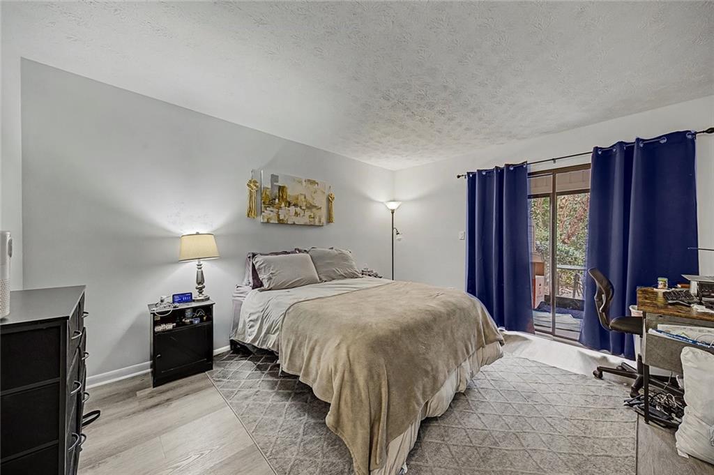 2911 Ironwood Road Southeast Marietta, GA 30067 - Photo 13 of 32 a bedroom with a bed and a closet