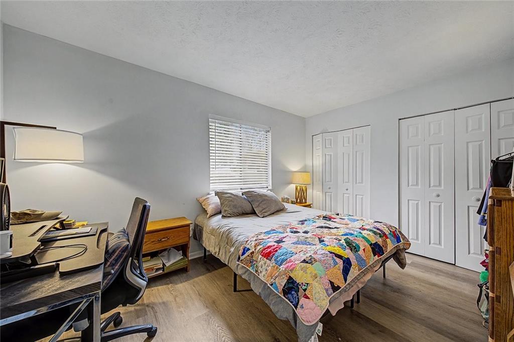 2911 Ironwood Road Southeast Marietta, GA 30067 - Photo 20 of 32 a bedroom with a bed and a desk