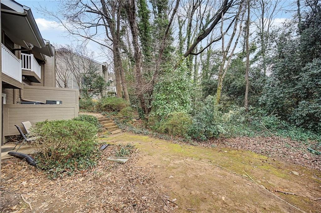 2911 Ironwood Road Southeast Marietta, GA 30067 - Photo 23 of 32 a view of a yard with plants and large trees