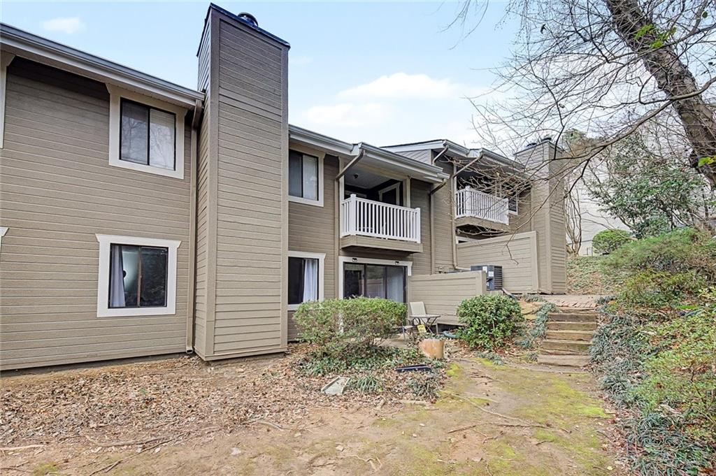 2911 Ironwood Road Southeast Marietta, GA 30067 - Photo 24 of 32 a front view of a house with a yard