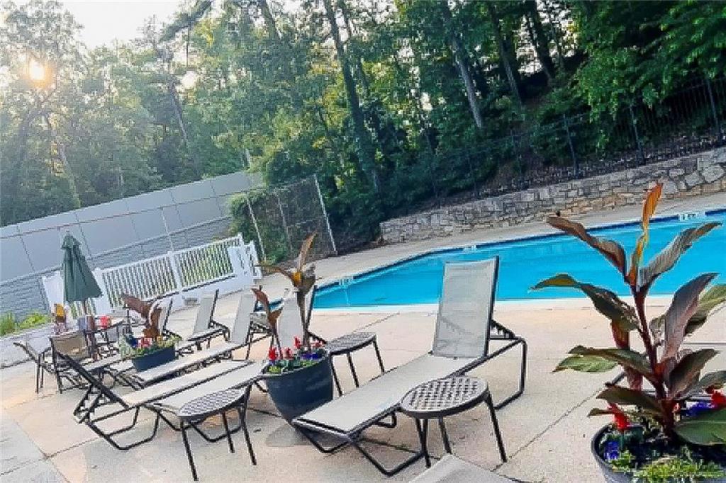 2911 Ironwood Road Southeast Marietta, GA 30067 - Photo 29 of 32 a backyard of a house with table and chairs