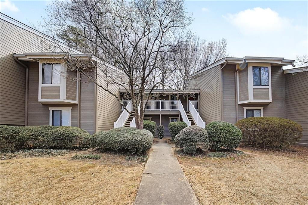 2911 Ironwood Road Southeast Marietta, GA 30067 - Photo 30 of 32 a front view of a house with garden