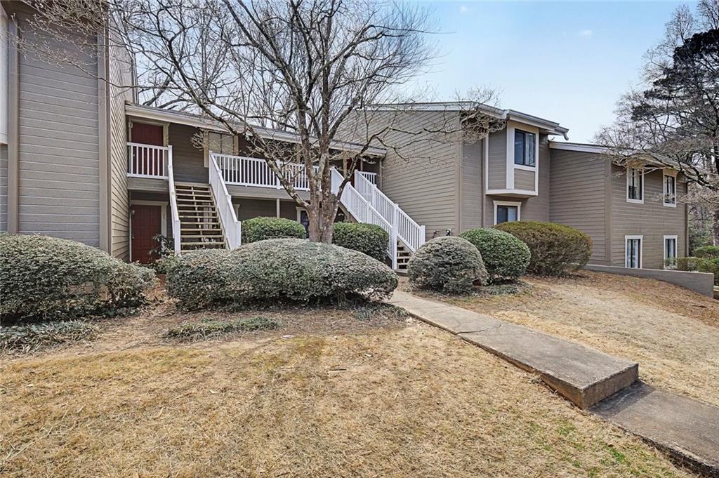 2911 Ironwood Road Southeast Marietta, GA 30067 - Photo 31 of 32 a view of a house with a yard and large tree