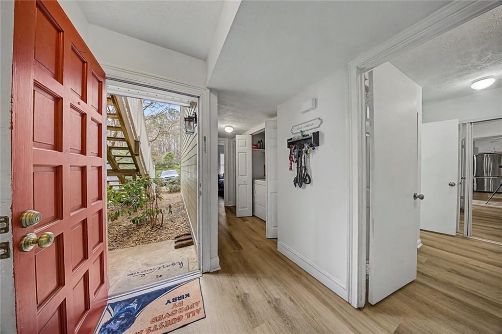 2911 Ironwood Road Southeast Marietta, GA 30067 - Photo 4 of 32 a view of an entryway with wooden floor and a livingroom