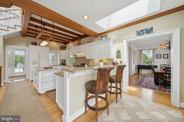 a bathroom with a tub sink shower and mirror