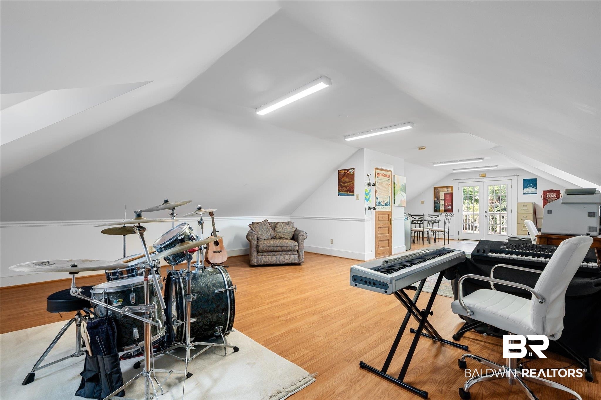 1210 Government Street Mobile, AL 36604 - Photo 30 of 37 Playroom featuring vaulted ceiling and hardwood / wood-style floors