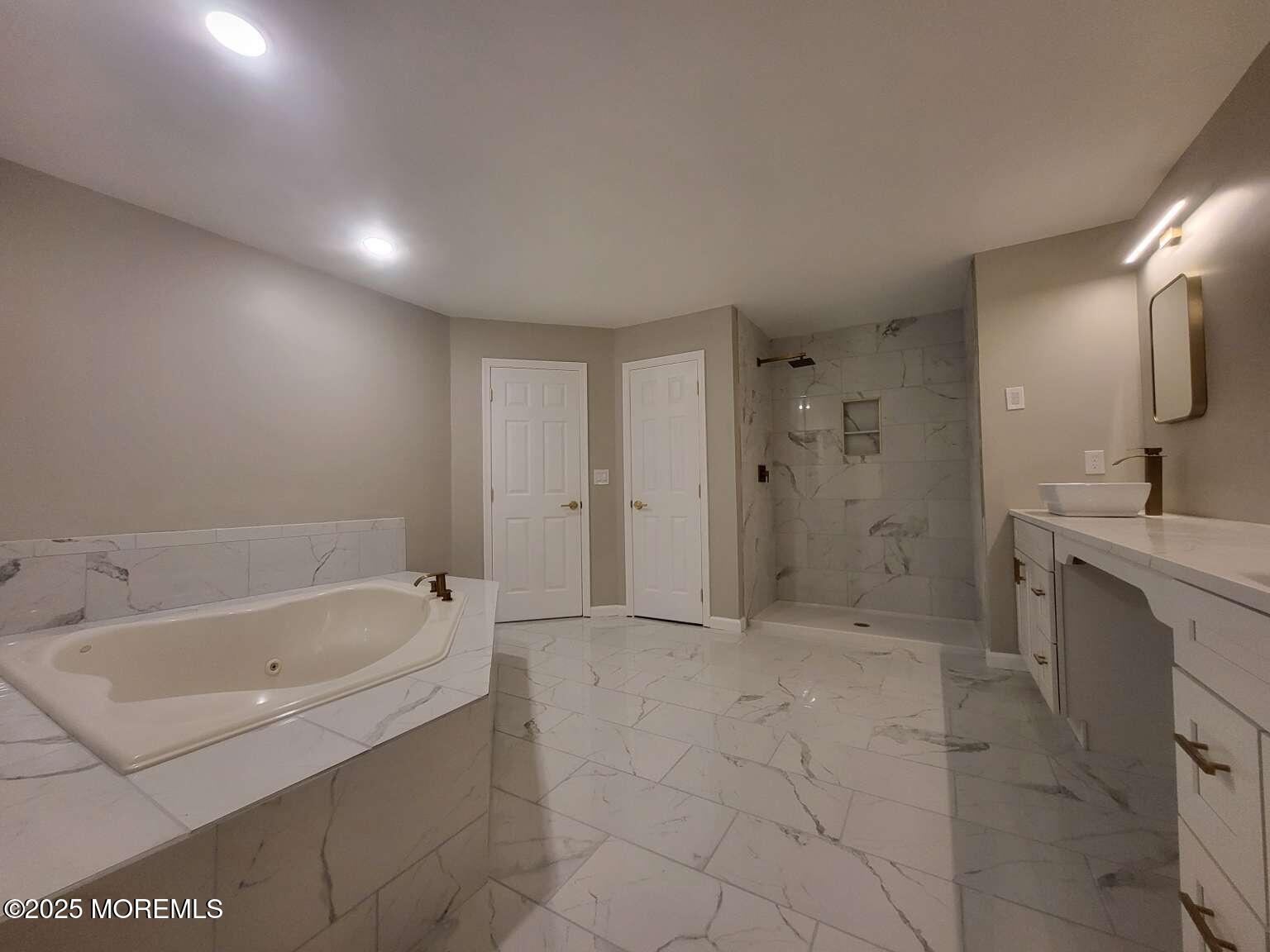 66 Potter Road Freehold, NJ 07728 - Photo 11 of 25 a bathroom with a bathtub and a sink