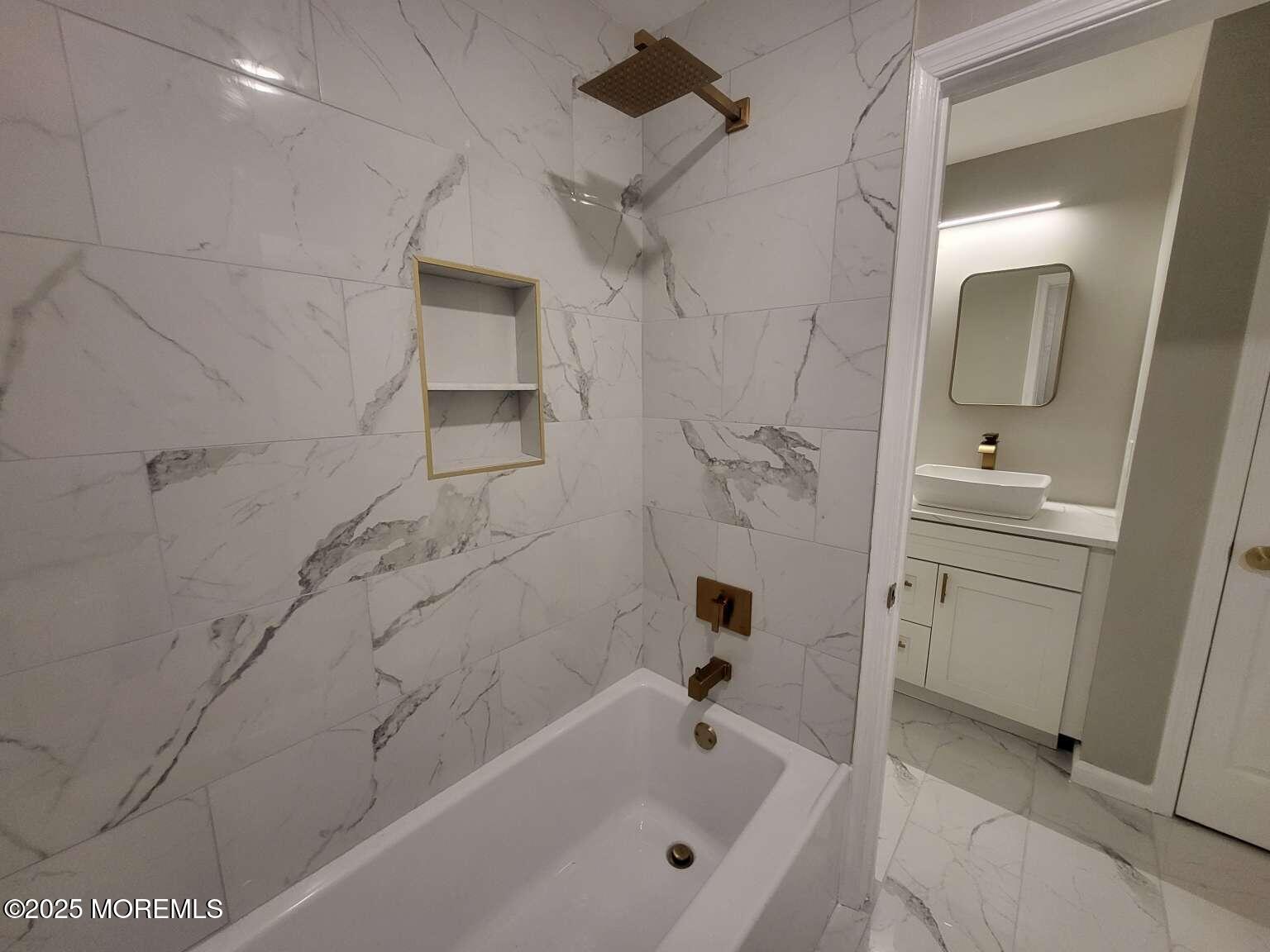 66 Potter Road Freehold, NJ 07728 - Photo 18 of 25 a bathroom with a bathtub and a sink