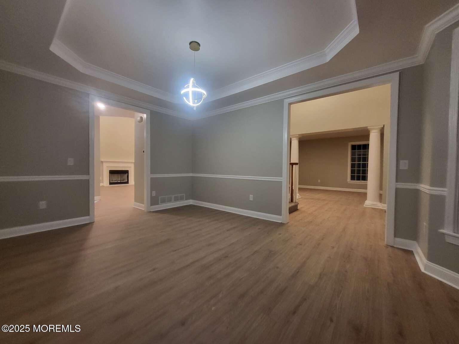 66 Potter Road Freehold, NJ 07728 - Photo 23 of 25 wooden floor in an empty room with a window
