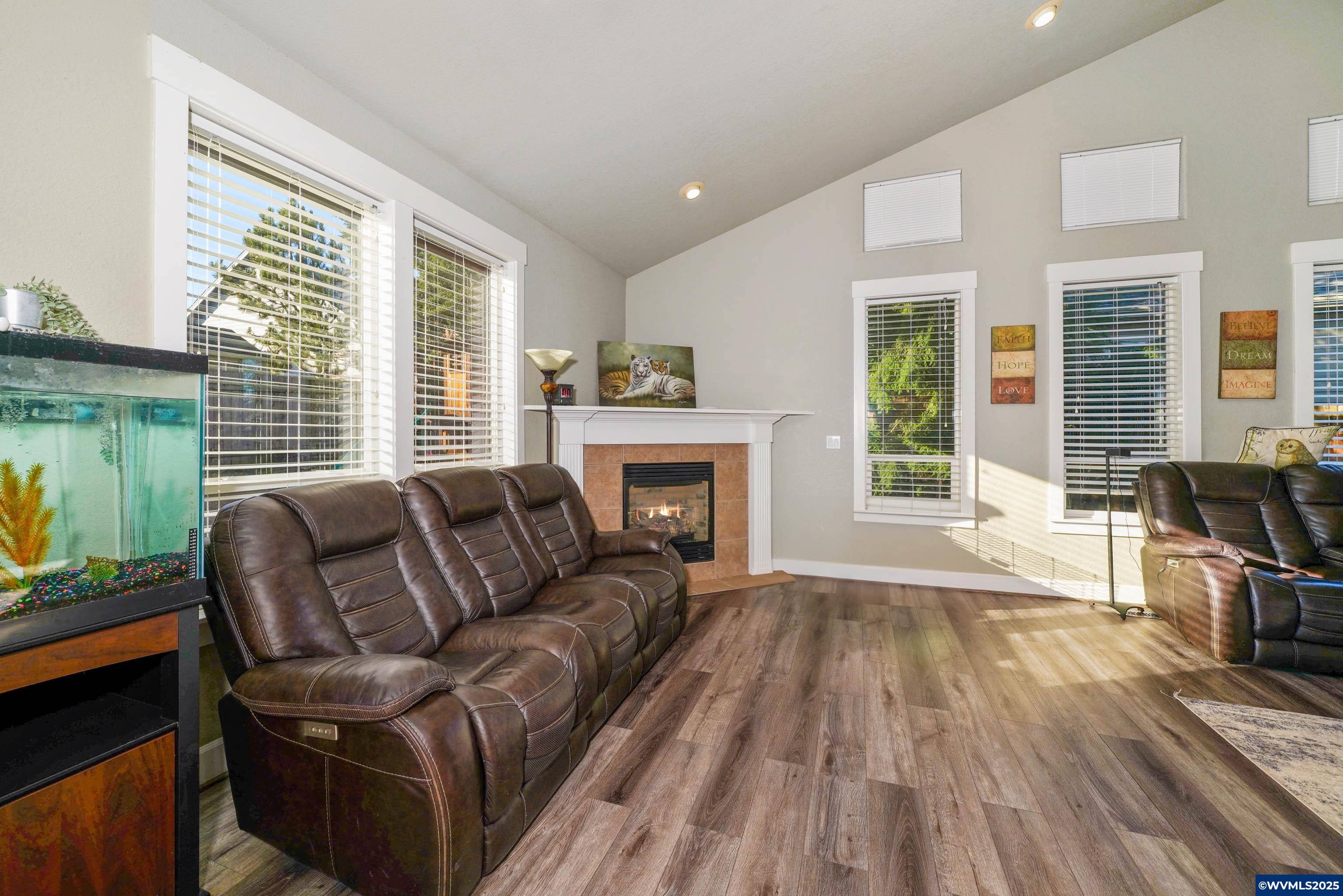 353 Northwest Reed Lane Dallas, OR 97338 - Photo 12 of 45 a living room with furniture and a fireplace