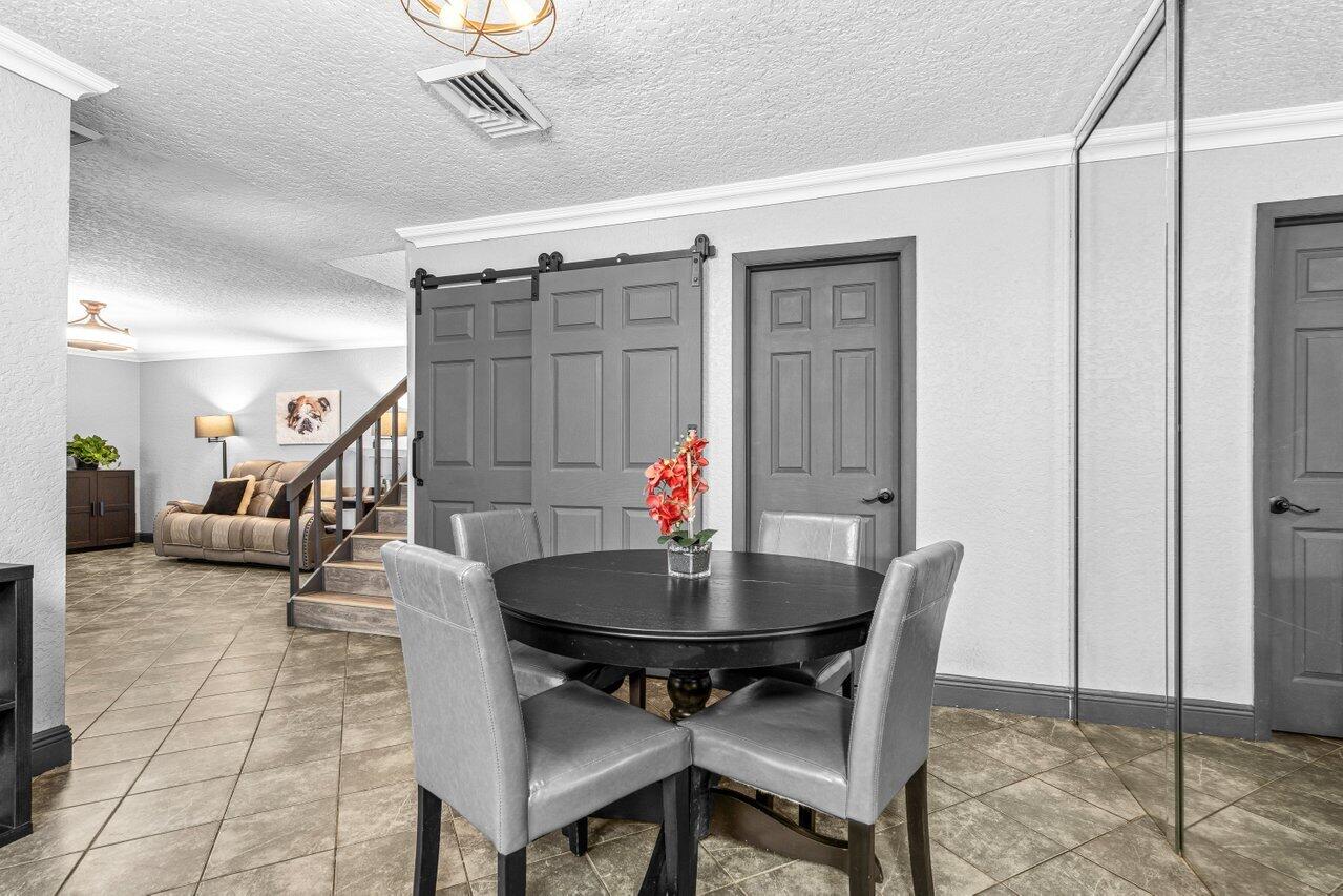 22180 Boca Rancho Drive, Unit B Boca Raton, FL 33428 - Photo 12 of 22 a workspace with furniture and a table