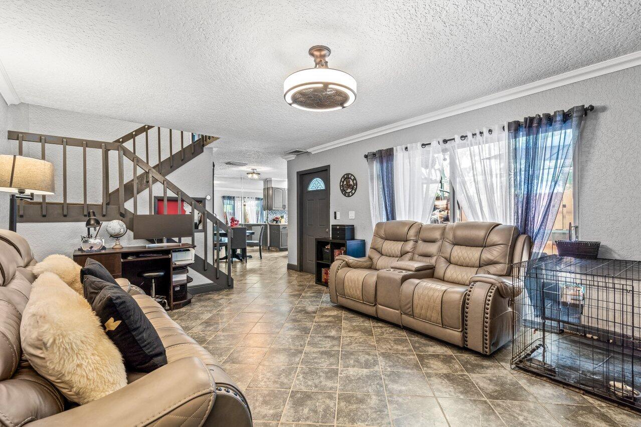 22180 Boca Rancho Drive, Unit B Boca Raton, FL 33428 - Photo 4 of 22 a living room with furniture and wooden floor