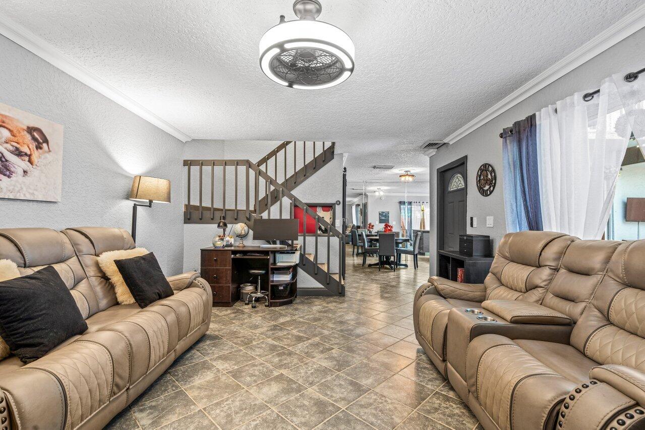22180 Boca Rancho Drive, Unit B Boca Raton, FL 33428 - Photo 5 of 22 a living room with furniture and a large window