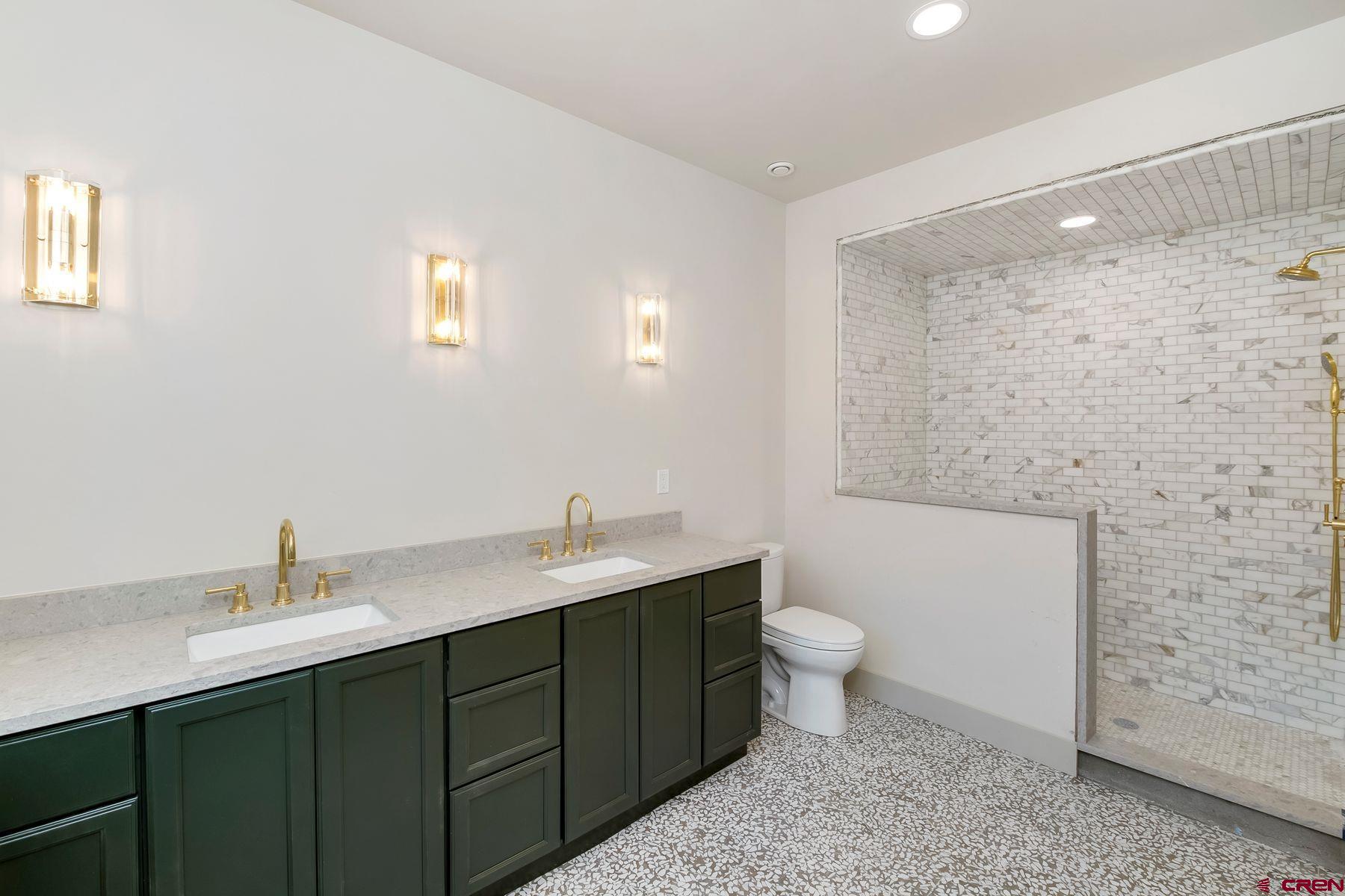 180 Elk Valley Road, Unit 124 Crested Butte, CO 81224 - Photo 7 of 23 a bathroom with a sink toilet and shower