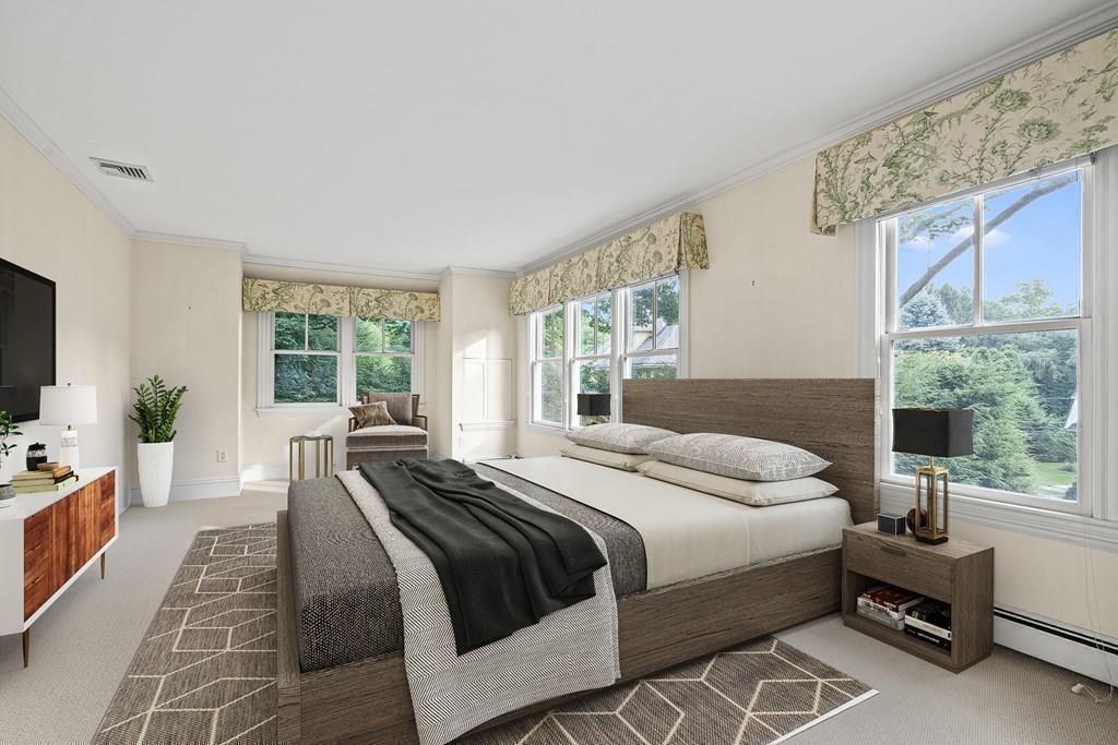 8 Garden Road Wellesley, MA 02481 - Photo 17 of 30 a bedroom with a bed and large windows