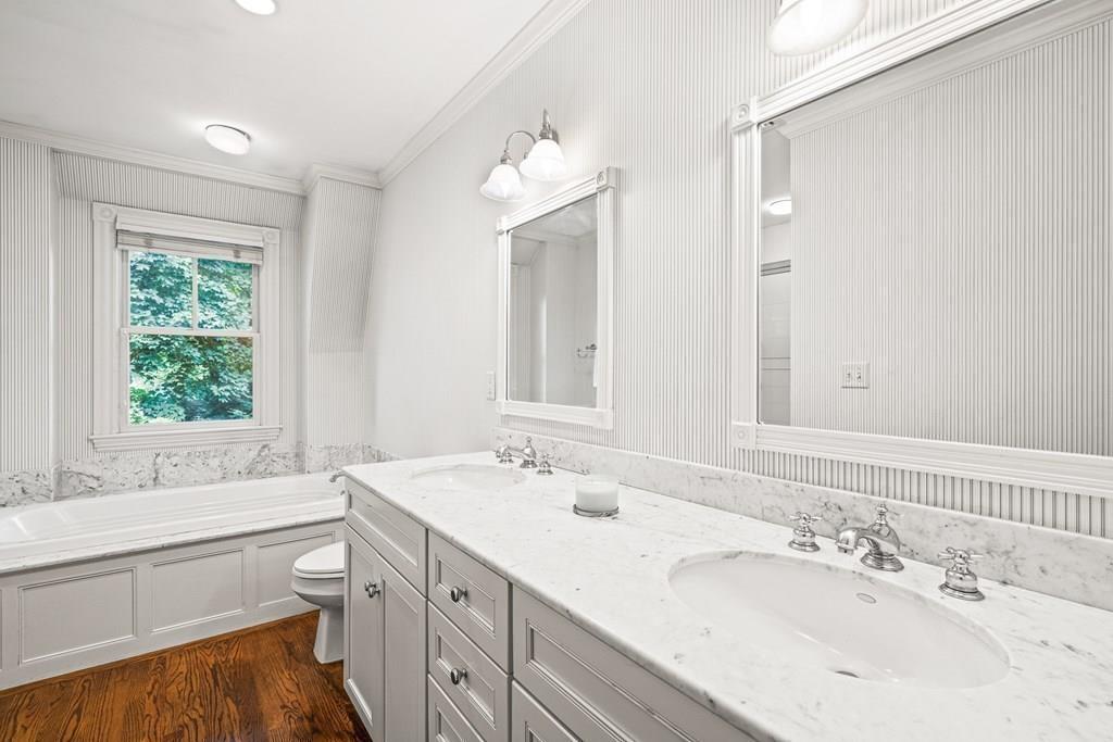 8 Garden Road Wellesley, MA 02481 - Photo 18 of 30 a bathroom with a tub sink and mirror