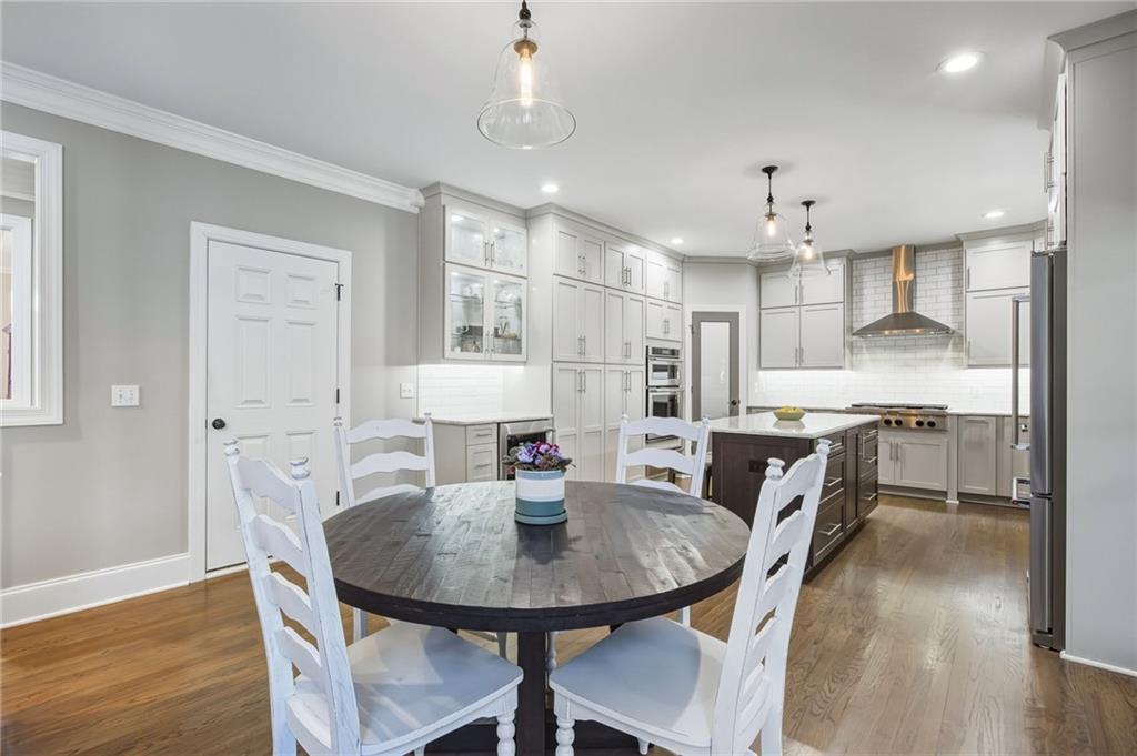5318 Tallgrass Way Kennesaw, GA 30152 - Photo 18 of 70 a view of a dining room with furniture and wooden floor