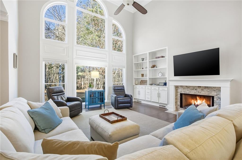 5318 Tallgrass Way Kennesaw, GA 30152 - Photo 2 of 70 a living room with furniture fireplace and flat screen tv