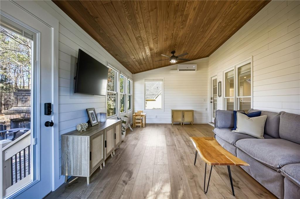 5318 Tallgrass Way Kennesaw, GA 30152 - Photo 26 of 70 a living room with furniture and a flat screen tv