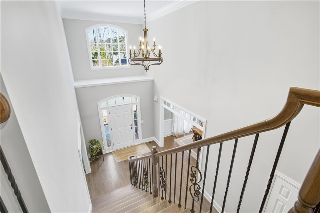 5318 Tallgrass Way Kennesaw, GA 30152 - Photo 29 of 70 a view of a hallway with wooden floor and staircase