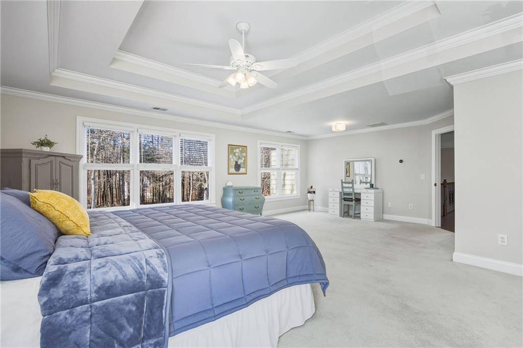 5318 Tallgrass Way Kennesaw, GA 30152 - Photo 32 of 70 a bedroom with a large bed and a window