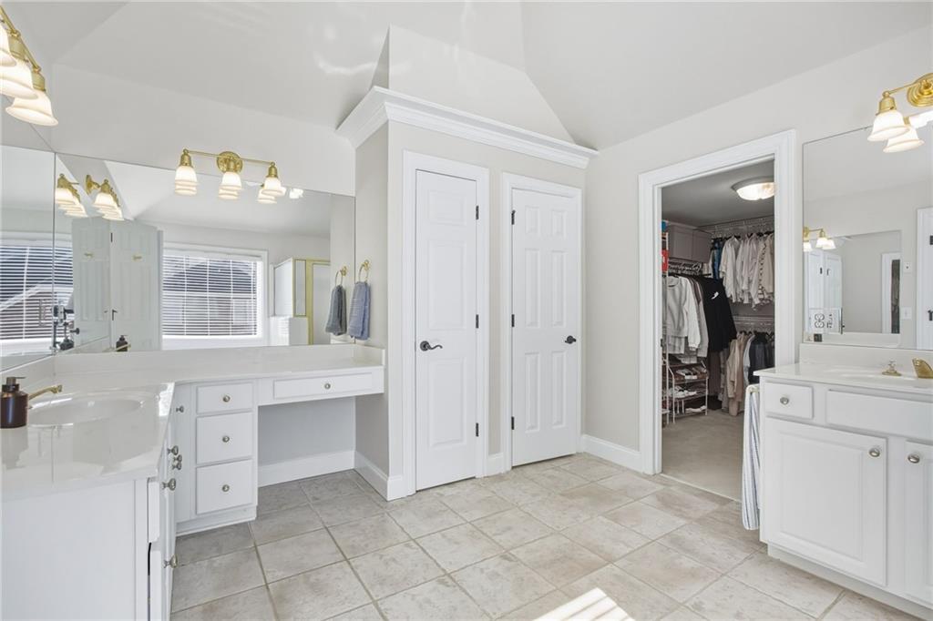 5318 Tallgrass Way Kennesaw, GA 30152 - Photo 35 of 70 a spacious bathroom with a double vanity sink mirror and a