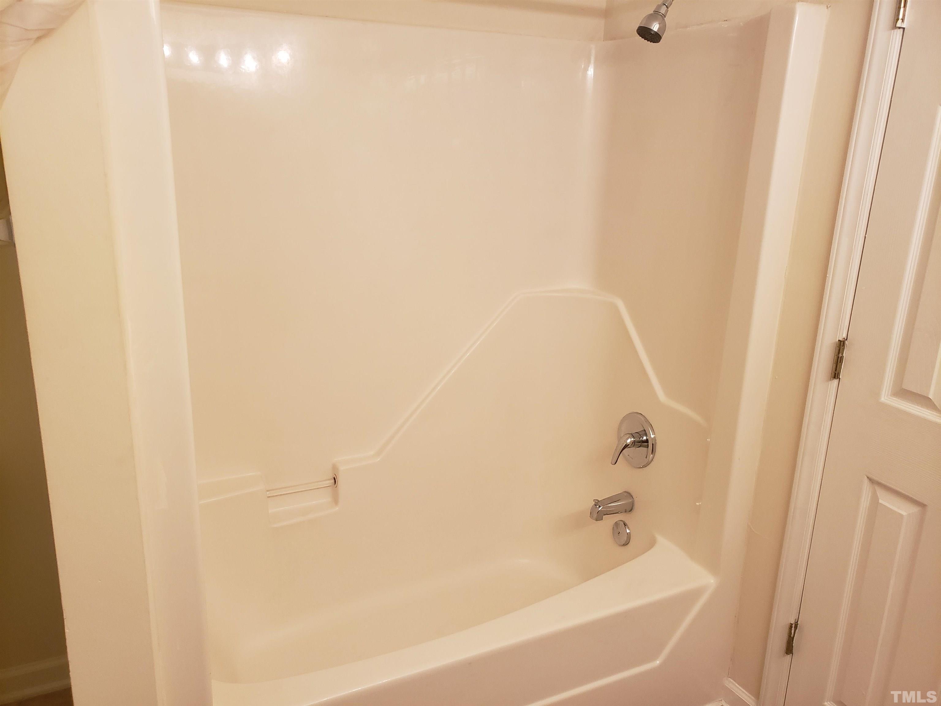 540 Barnes Lake Road, Unit B Middlesex, NC 27557 - Photo 14 of 17 a bathroom with a bathtub