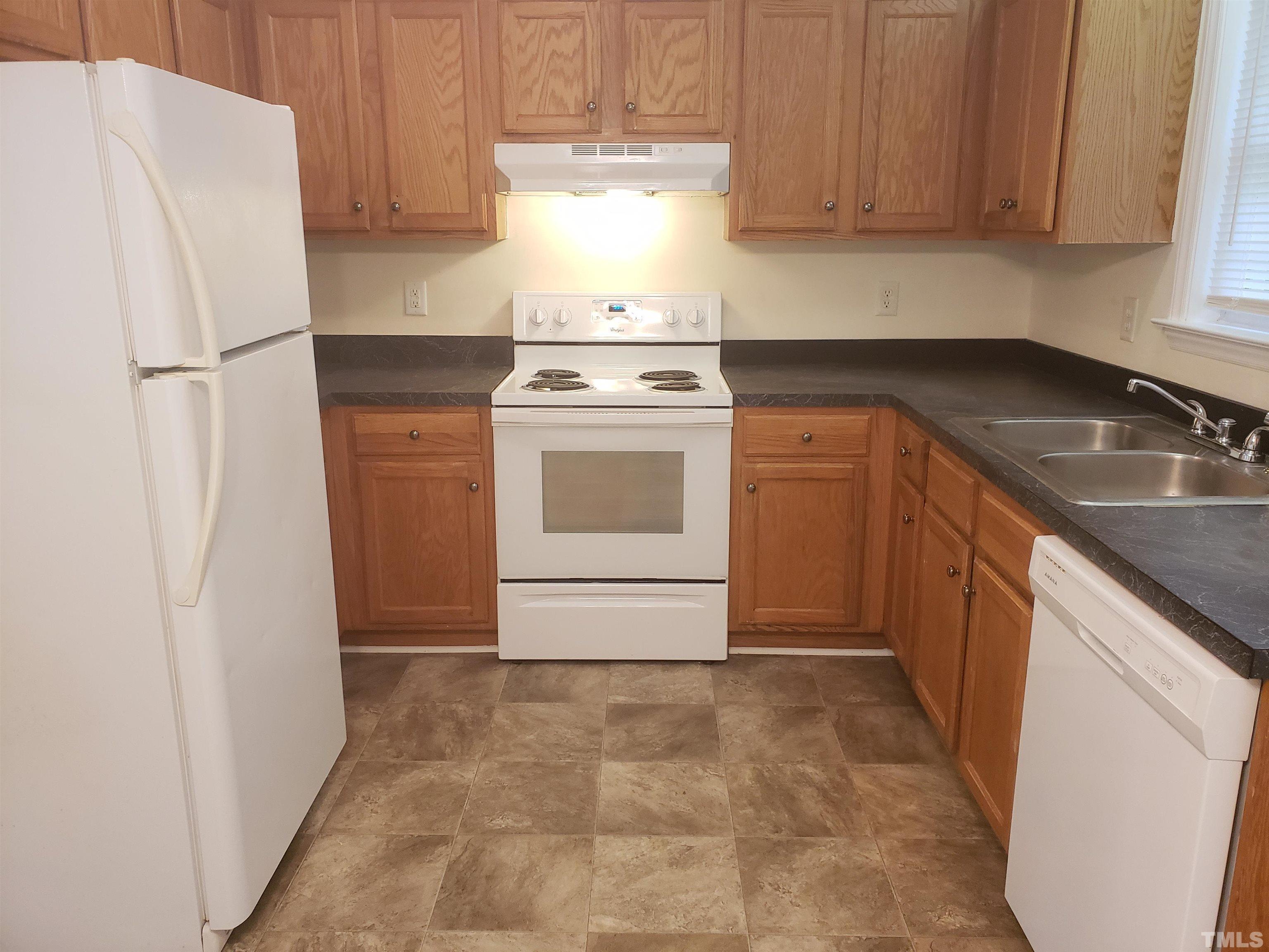 540 Barnes Lake Road, Unit B Middlesex, NC 27557 - Photo 3 of 17 a kitchen with a stove sink and refrigerator