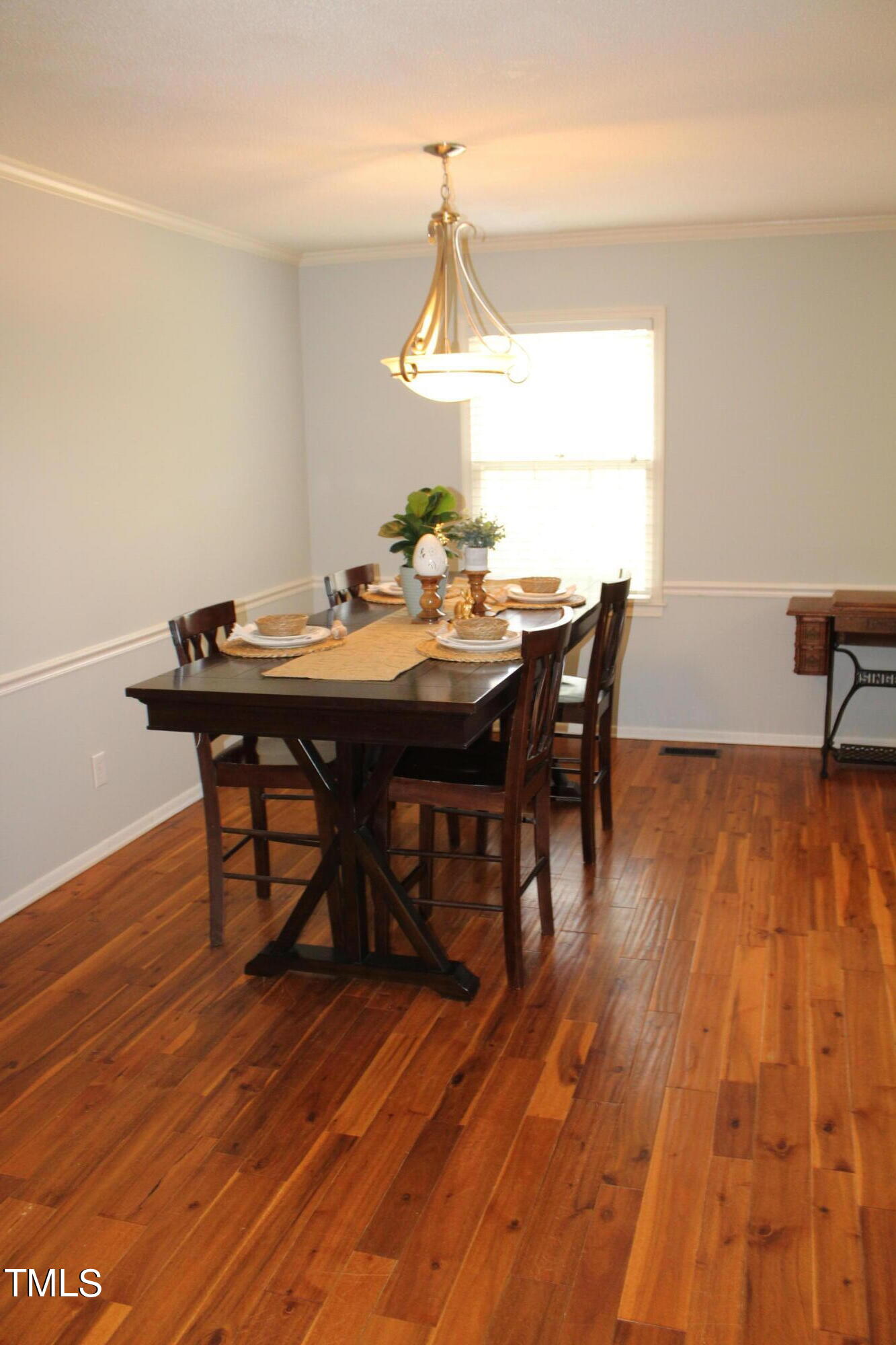 3508 Morningside Drive Raleigh, NC 27607 - Photo 23 of 58 a view of a dining room with furniture window and wooden floor