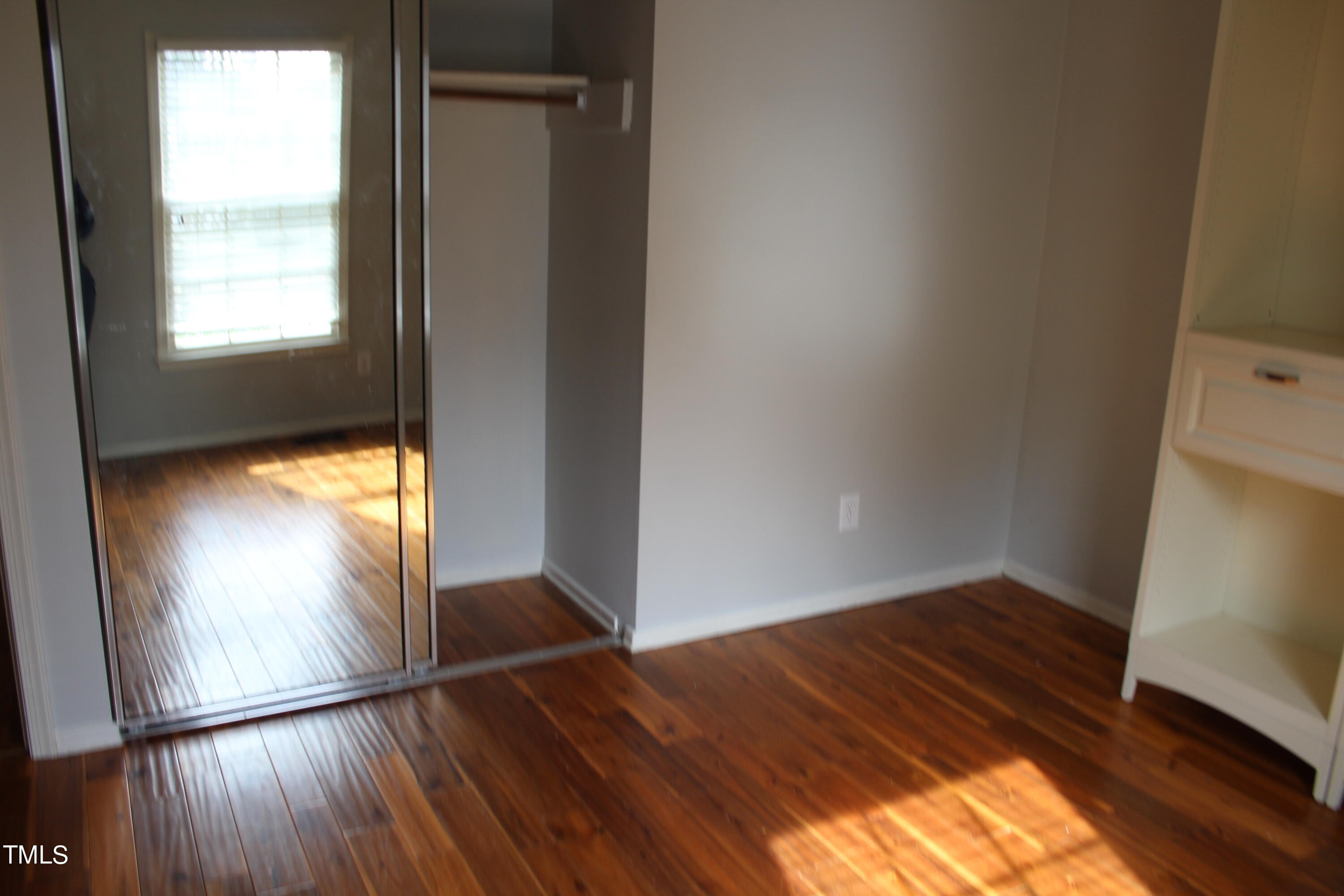 3508 Morningside Drive Raleigh, NC 27607 - Photo 45 of 58 an empty room with wooden floor and windows