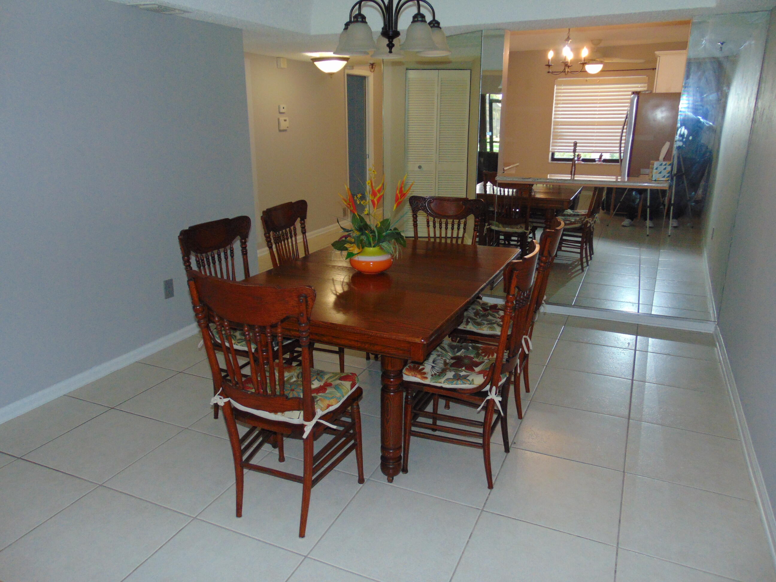 9220 Southwest 14th Street, Unit 3103 Boca Raton, FL 33428 - Photo 16 of 58 a view of a dining room with furniture