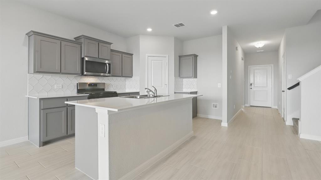 1234 Rockwater Drive Decatur, TX 76234 - Photo 38 of 40 Kitchen-All Home and community information, including pricing, included features, terms, availability and amenities, are subject to change at any time without notice or obligation. All Drawings, pictures, photographs, video, square footages, floor plans, elevations, features, colors and sizes are approximate for illustration purposes only and will vary from the homes as built.