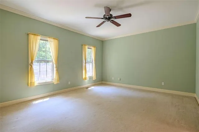 a view of empty room with windows