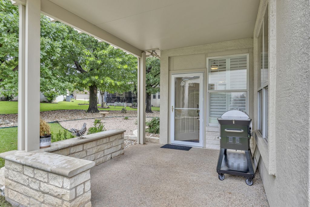 144 Cattle Trail Way Georgetown, TX 78633 - Photo 24 of 37 A welcoming covered patio provides a delightful outdoor living space, perfect for tranquil relaxation.